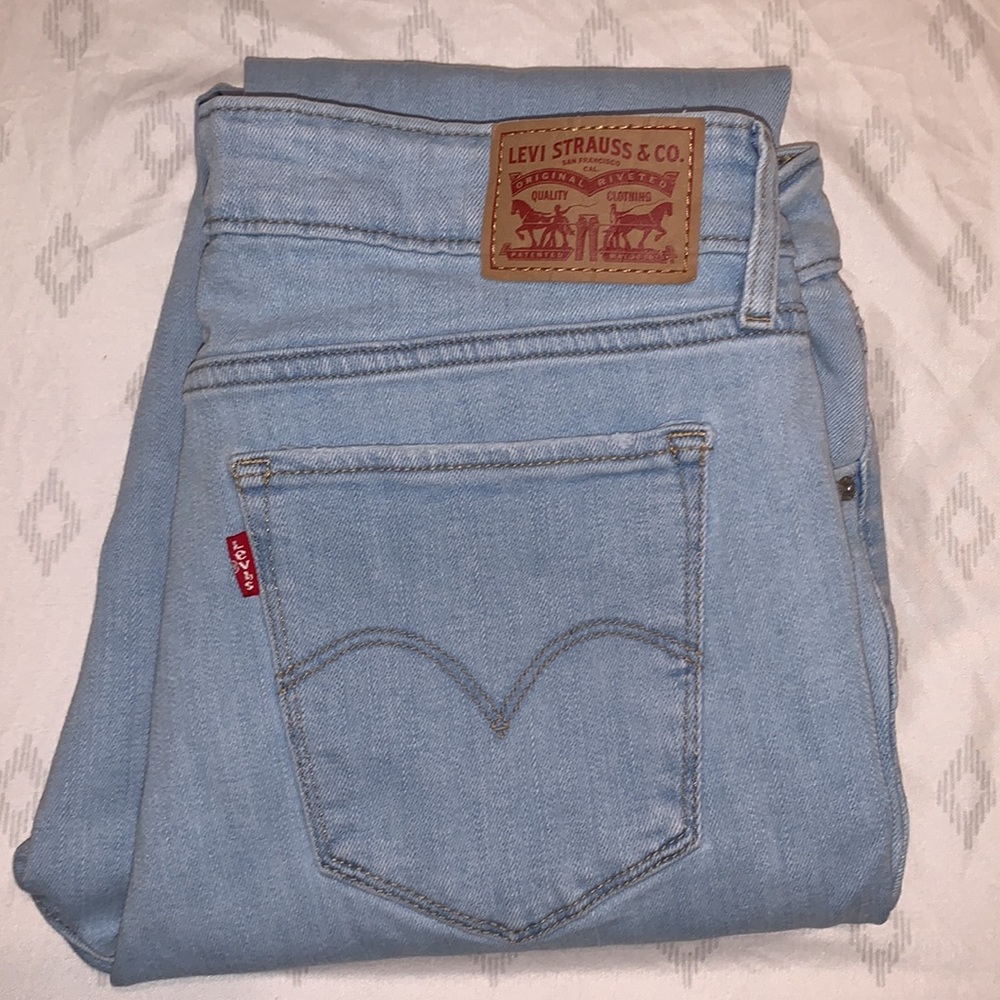 LEVI’s 711 Ripped Mid Rise Skinny Jeans